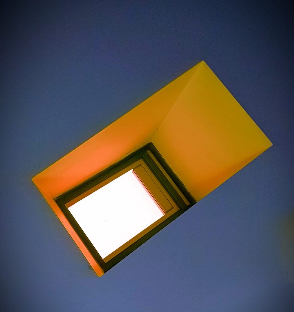 Whit skylight, orange inset with blue ceiling.